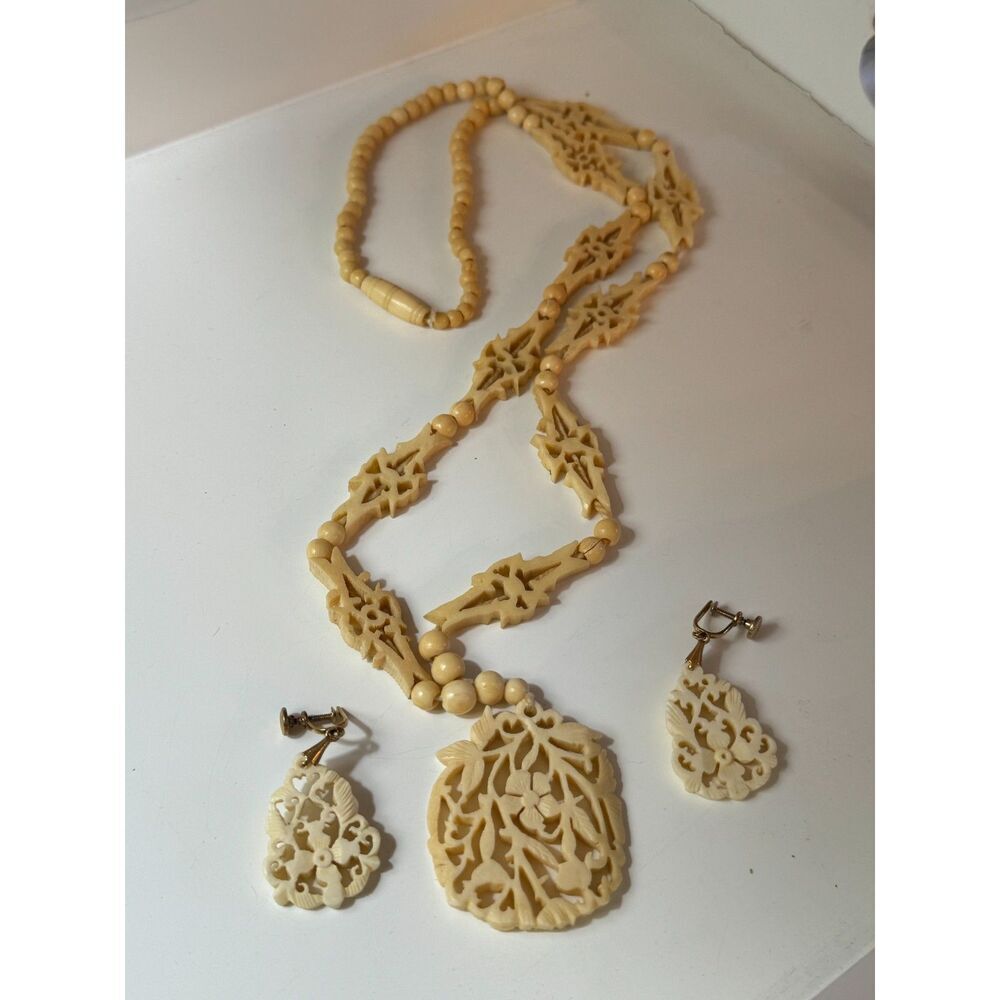 Antique carved bone necklace and clip on earrings